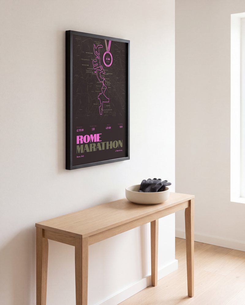 A Rome Marathon running print in Black Bean, in a black frame, in a hallway